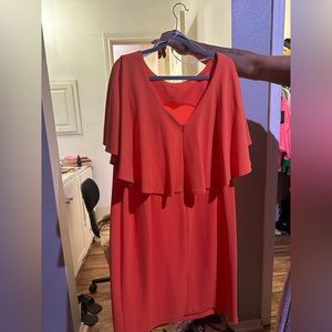This is a Orange Calvin Klein dress WORN ONCE knee to mid knee length